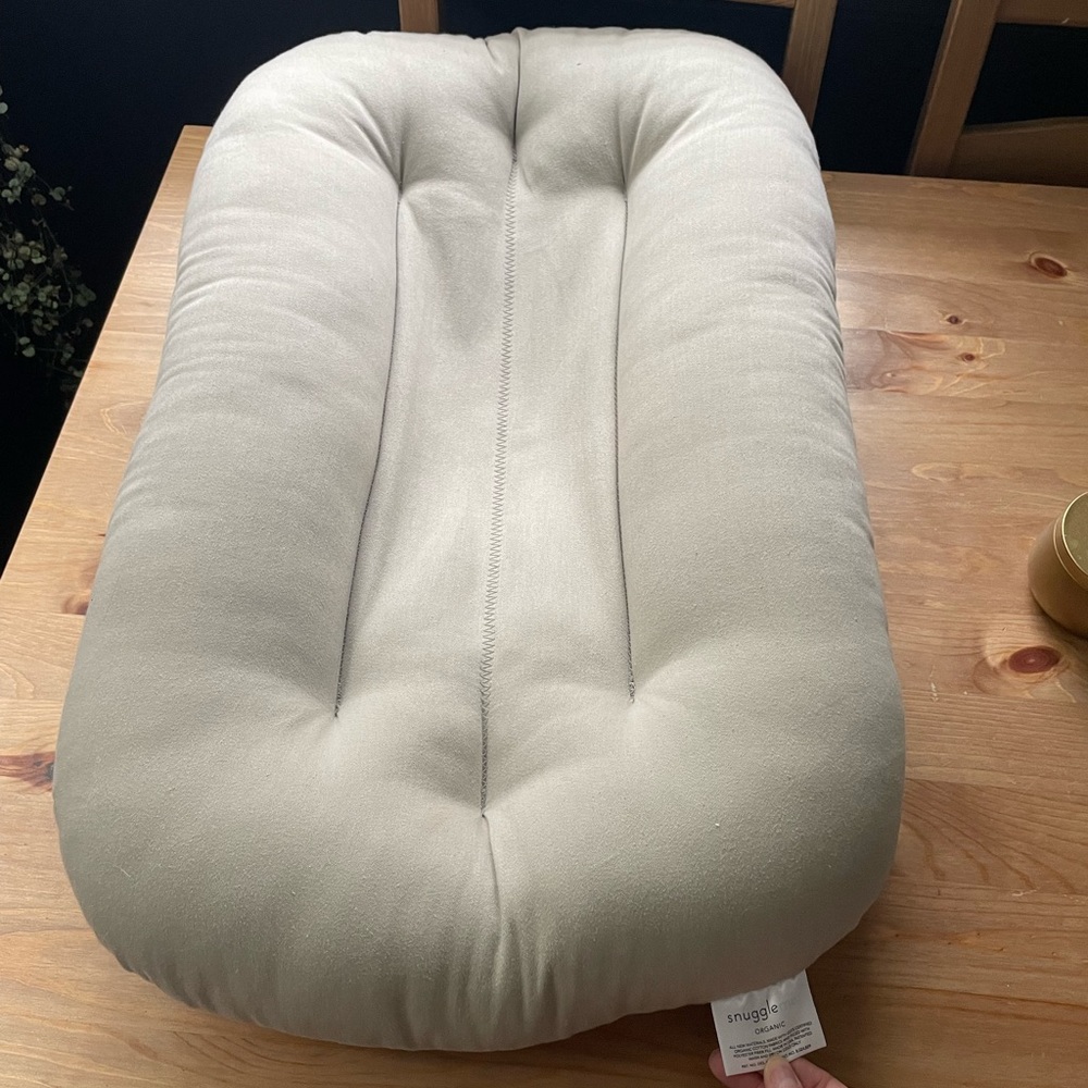 Snuggle me organic infant lounger in beige.